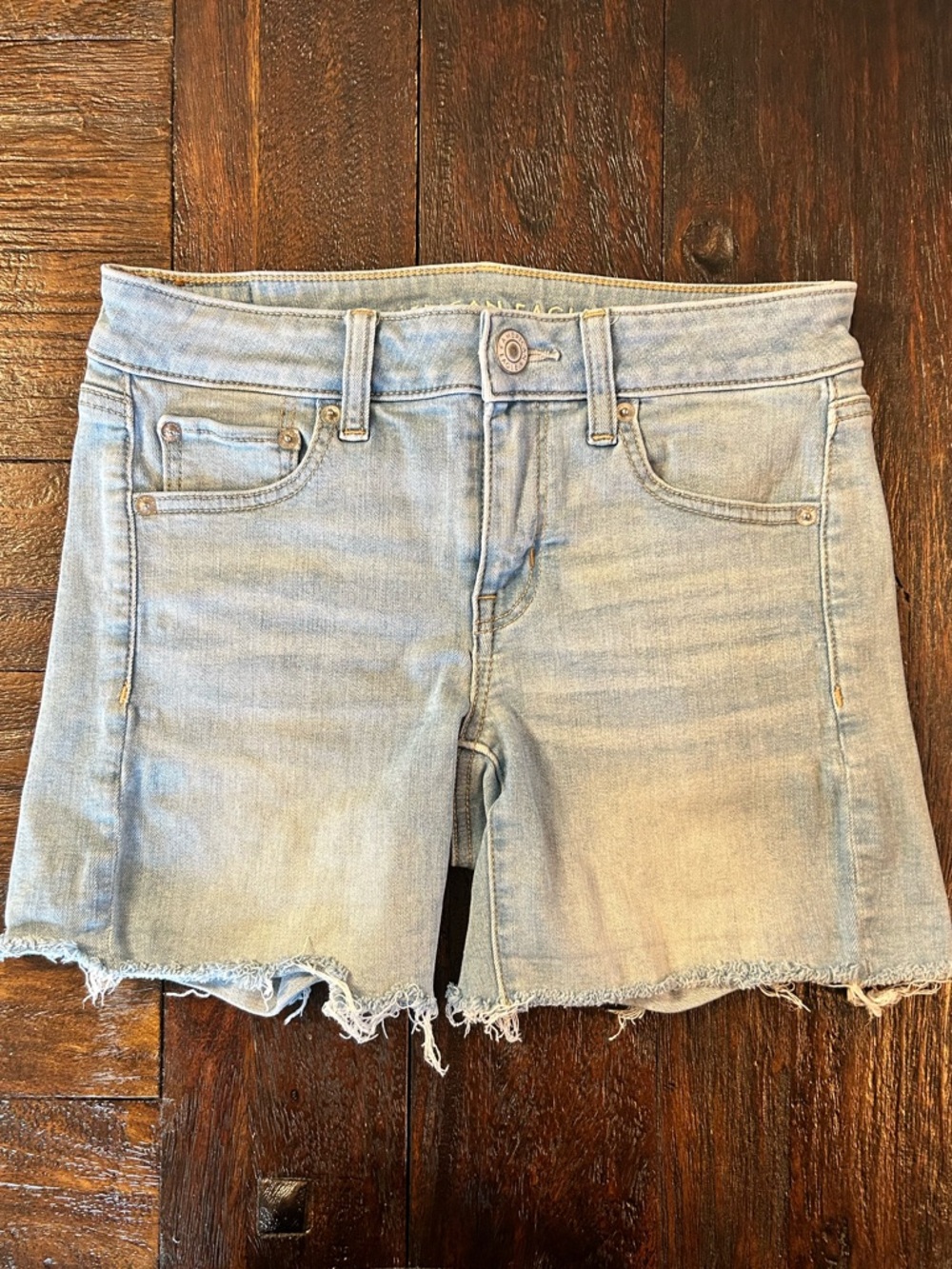 American Eagle Outfitters Midi Next Level Stretch Denim Frayed Hem Shorts